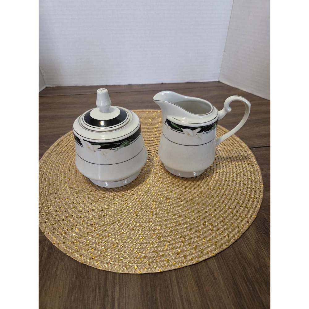 creamer and lidded sugar bowl from the Black Fantasy (Pattern 8391) pattern...